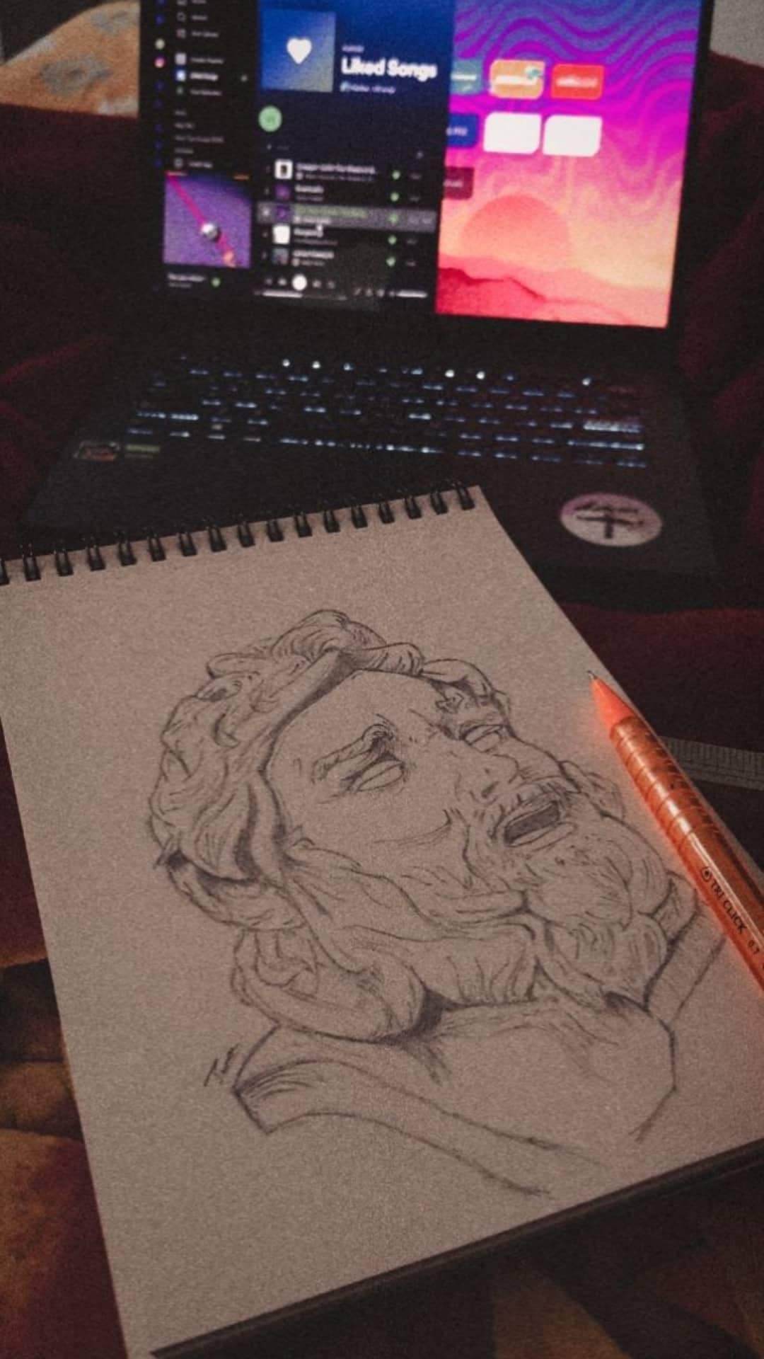 Graphite study of a classical Greek bust in three-quarter view.